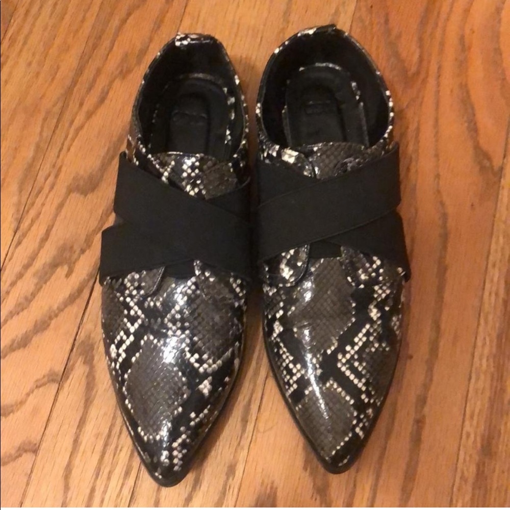 black snakeskin pointed flats